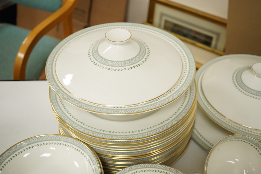A Royal Doulton Berkshire pattern part dinner service to include tureens, twin handled cups and oval platters, largest 33cm wide. Condition - mostly good